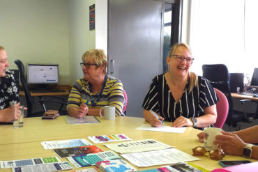 Pan Employability Project photo showing women sitting around desk