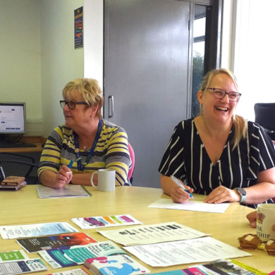 Pan Employability Project photo showing women sitting around desk