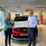 Premier Ford handing over giant cheque to Youth Trust