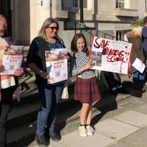 School protest outside County Hall - children and parents holding banners