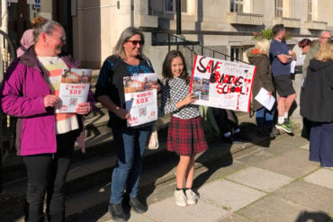 School protest outside County Hall - children and parents holding banners