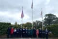 Sergeant Matt Browne, Councillor Debbie Andre, Wendy Perera IWC Chief Executive, Mark Southwell Cowes RNLI, a representative from Police, Graham Biss High Sheriff, Councillor Karl Love IWC Chairman, Flag Raiser Louise Walker and Victoria White from Ambulance service, Jeff Walls Hampshire and IOW Fire service, Jayne Tyler, Councillor Chris Jarman, Councillor Claire Mosdell, Councillor Ian Ward