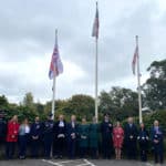 Sergeant Matt Browne, Councillor Debbie Andre, Wendy Perera IWC Chief Executive, Mark Southwell Cowes RNLI, a representative from Police, Graham Biss High Sheriff, Councillor Karl Love IWC Chairman, Flag Raiser Louise Walker and Victoria White from Ambulance service, Jeff Walls Hampshire and IOW Fire service, Jayne Tyler, Councillor Chris Jarman, Councillor Claire Mosdell, Councillor Ian Ward