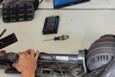 Someone mending a vacuum cleaner at repair cafe