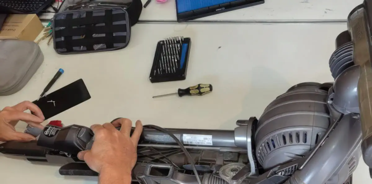 Someone mending a vacuum cleaner at repair cafe