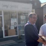 ieuan jehu handing over petition to richard quigley MP outside mydentist Freshwater