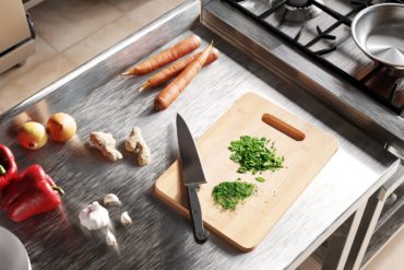 kitchen scene showing vegetables and hob