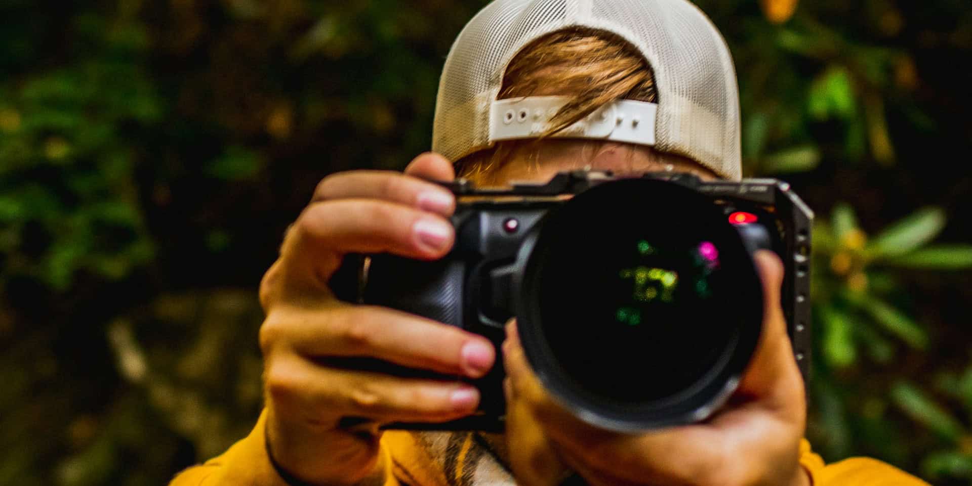 photographer pointing his camera at the photographer