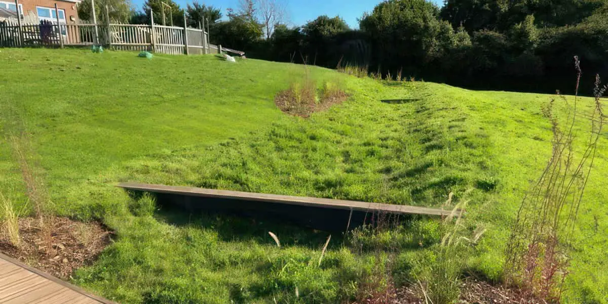 a swale in place at Nettlestone primary school - it's a sort of ditch in the grassy area with a small bridge over