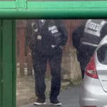 traffic wardens ticketing cars parked in restricted areas