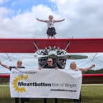 Mountbatten’s director of operations, Becky McGregor, sitting on top of the Ethel Dares Wing Walking plane, with (front, from left) Mountbatten nurse Rhoda Thomas, Kevin Foss, Mountbatten nurse Jackie Whiller