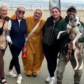 Women taking part in the Barefoot walk dressed in bear outfits