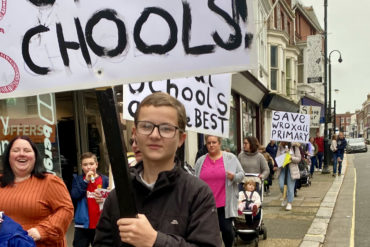 School closure protest in Newport - October 2024 - showing protestors marching to County Hall