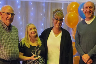 Laura Groves Award winner, Jade Harrison, from Wootton Primary School, with headteacher Jane Wilford presented by Steve Groves and Peter Groves.