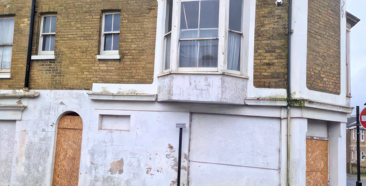 Exterior of the Sandown eyesore - a building with boarded up windows