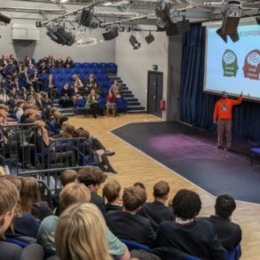 Stuart Lawrence addressing year 10 to upper 6th pupils