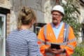 Island roads worker talking to resident