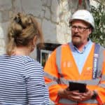 Island roads worker talking to resident