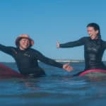 Women on surfboards in the water