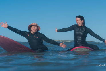 Women on surfboards in the water