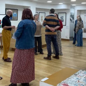 People at the private view of the Art retrospective at Independent Arts