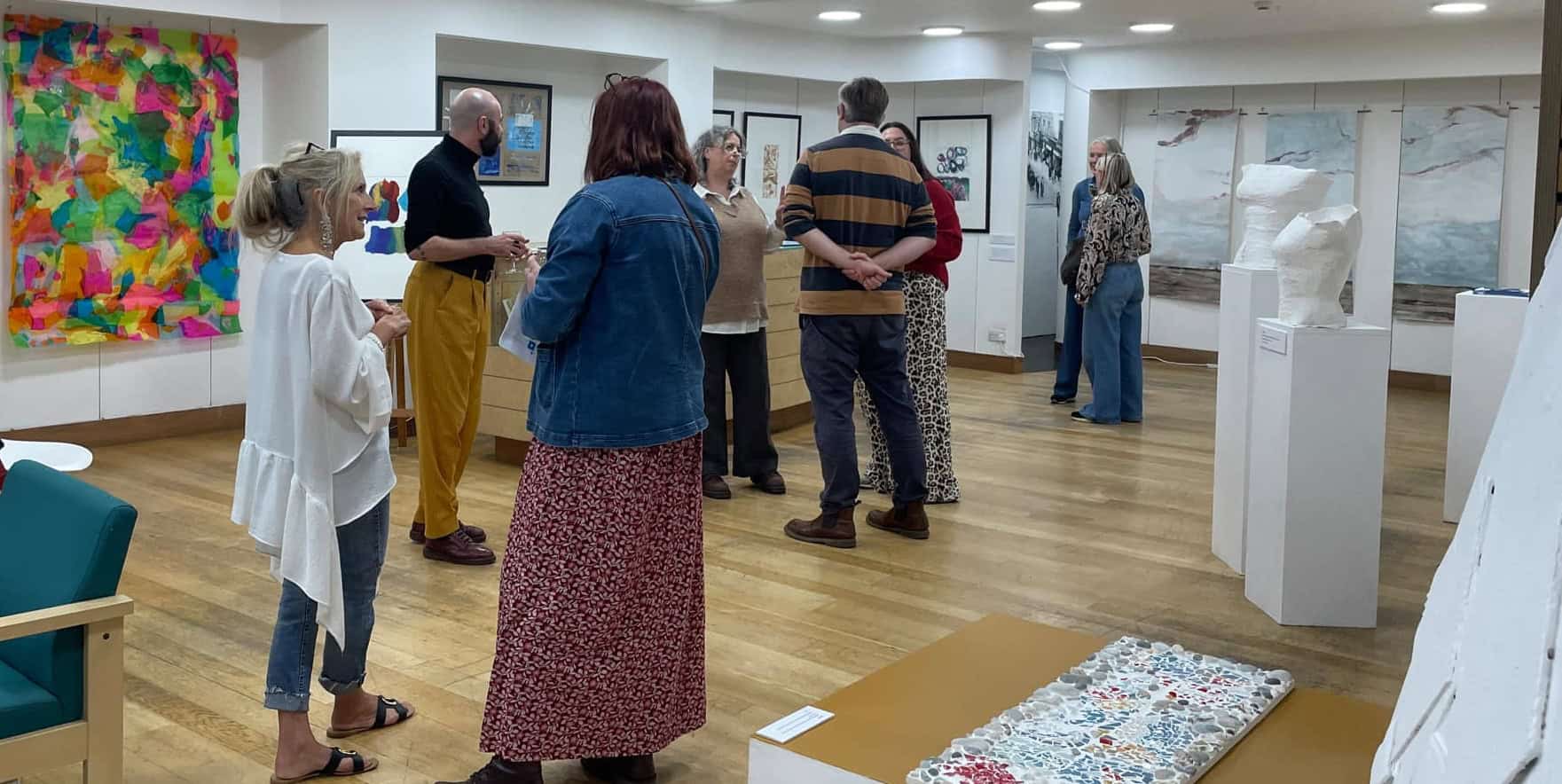 People at the private view of the Art retrospective at Independent Arts