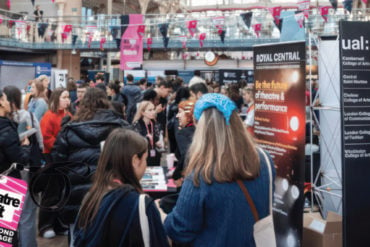 Young people milling around the theatrecraft marketplace event