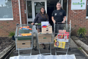 young farmers with trollies full of food donations