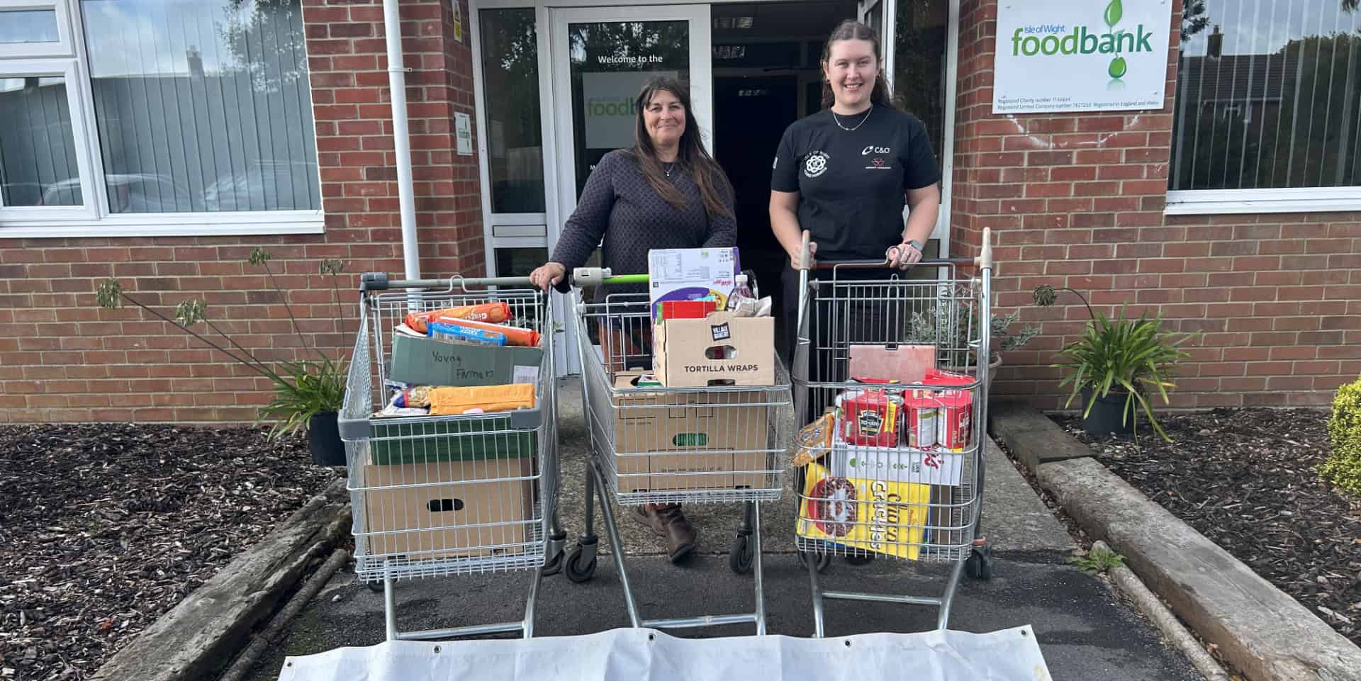 young farmers with trollies full of food donations