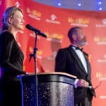 Fran Collins speaking at the podium during the awards ceremony