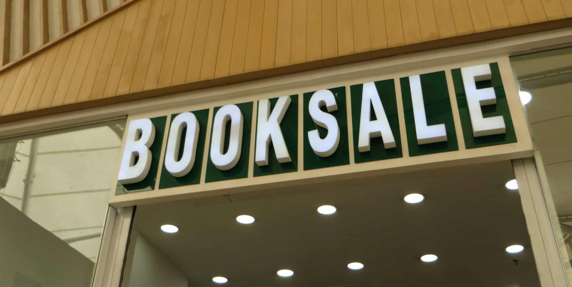 Book sale sign at library