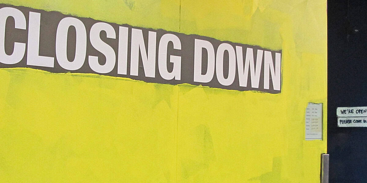 Closing down sign on shop window