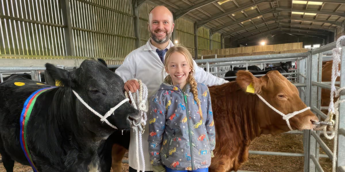 Farmer and daughter with two calves at the gilten market