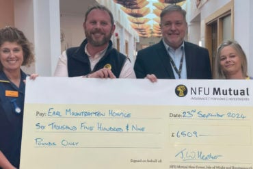 John Heather, Nigel Hartley and Mountbatten nurses with giant cheque