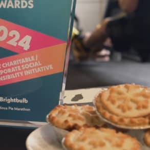 A plate of mince pies alongside an award