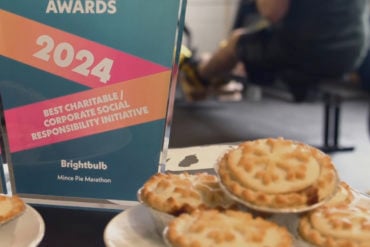 A plate of mince pies alongside an award