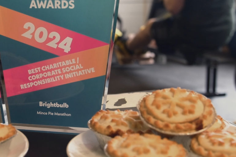 A plate of mince pies alongside an award