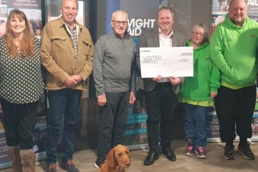 Representative of IW Pony Club, Cat, a nursery nurse from the neonatal unit, Graeme Burnett from Ventnor Cricket Club, representative of Ventnor Youth FC, Jon Carter, WightAID donor from Betapak, reps from Ventnor Carnival Association, and WightAID founder Geoff Underwood. Front is Mavis, the WightAID dog.