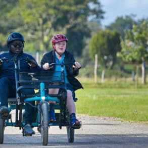 People on adapted bicycles for those with learning or physical difficulties