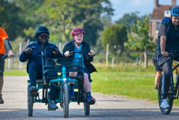 People on adapted bicycles for those with learning or physical difficulties