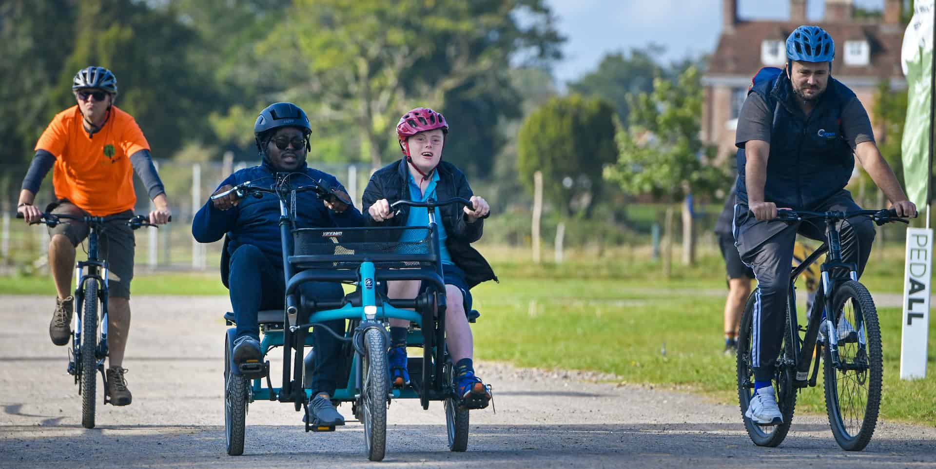 People on adapted bicycles for those with learning or physical difficulties