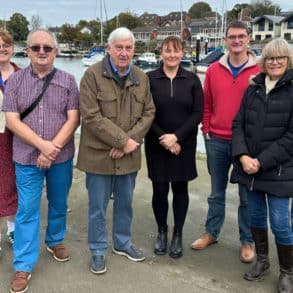 Representatives from Wootton Creek Fairway Association, Wootton Bridge Parish Council and Fishbourne Parish Council in front of Wootton Creek