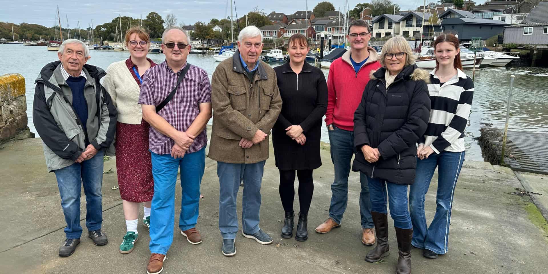 Representatives from Wootton Creek Fairway Association, Wootton Bridge Parish Council and Fishbourne Parish Council in front of Wootton Creek