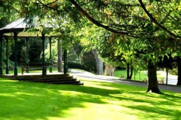 Ventnor Park bandstand with sun dapples on the grass