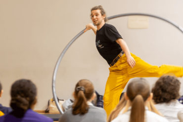 Thorn on the acrobat's wheel showing pupils his skills