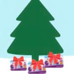 Illustration of a christmas tree with library cards underneath it