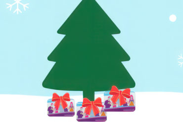 Illustration of a christmas tree with library cards underneath it