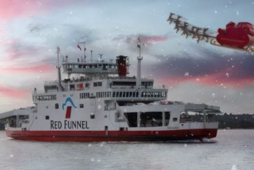 Red Funnel Ferry on the Solent, with snow in the air and Father Christmas with sleigh and reindeer flying past