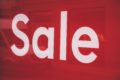 white on red sale sign by markus spiske