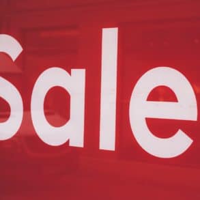 white on red sale sign by markus spiske